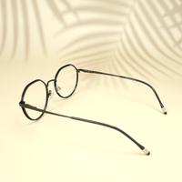 Black round unisex metal eyeglasses ( eq0003 918310 )